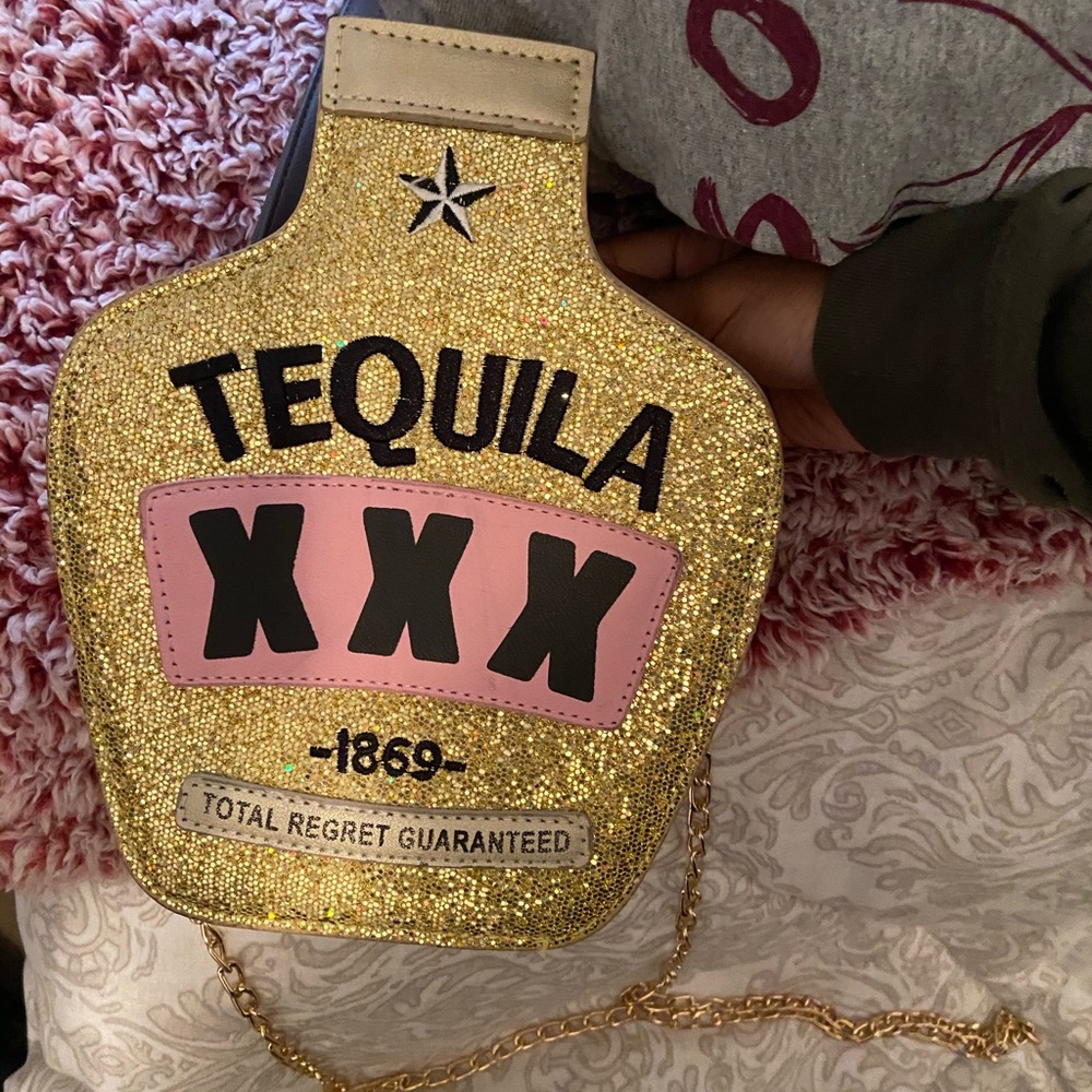 Tequila shaped purse. Very Cute, No big time name brand. Purchased from boutique